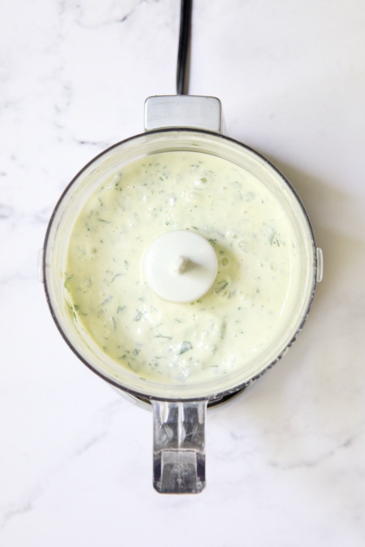 Garlic Basil Aioli in mini food processor.