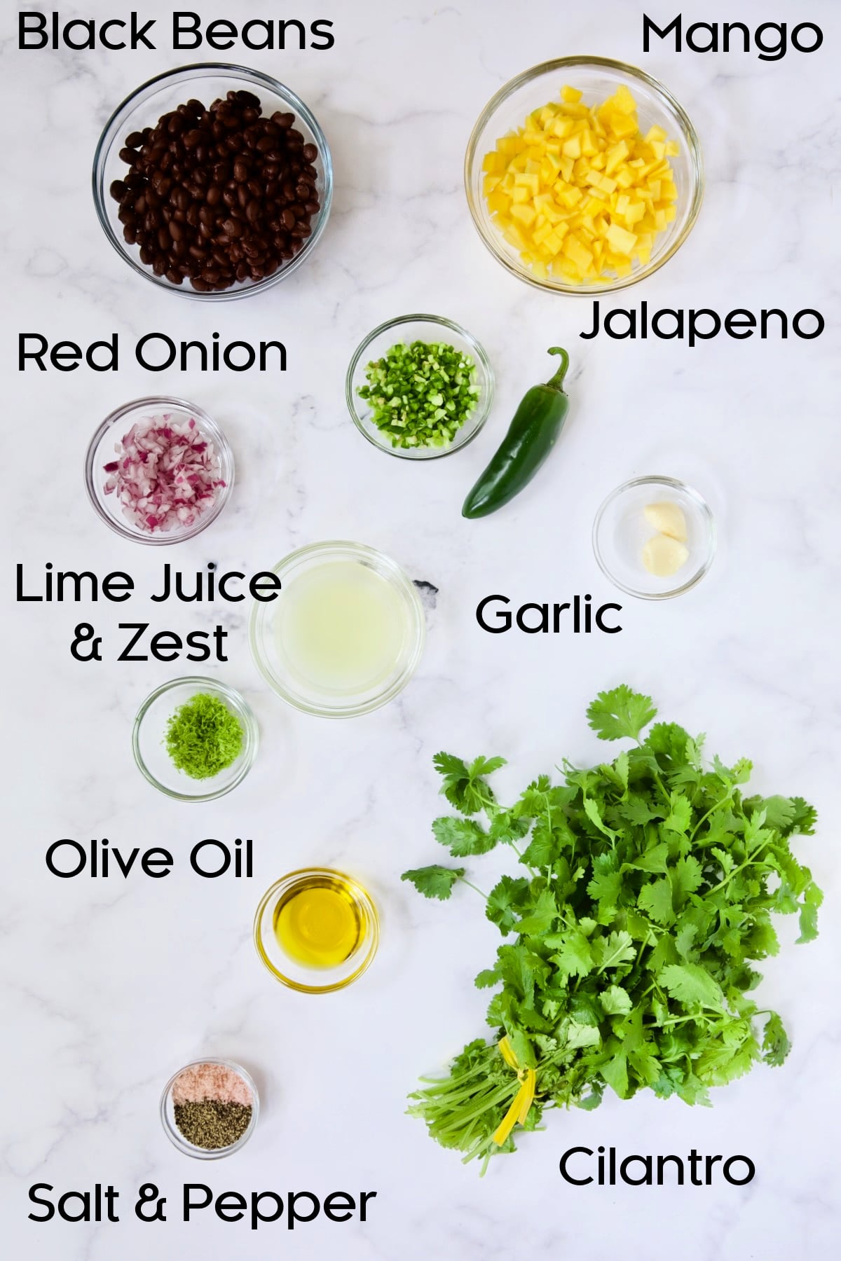 Ingredients for Mango Black Bean Salsa in glass bowls.