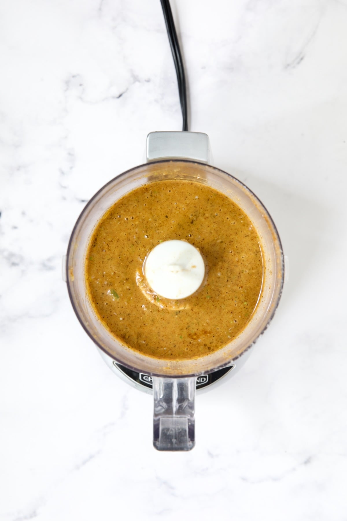 Pureed marinade in mini food processor.