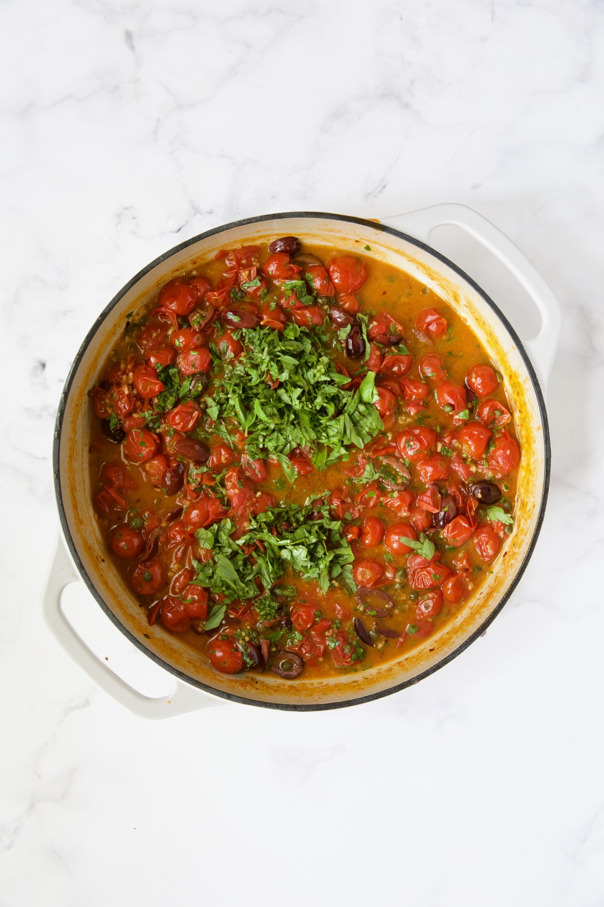 Cherry tomato puttanesca sauce with the fresh herbs added.