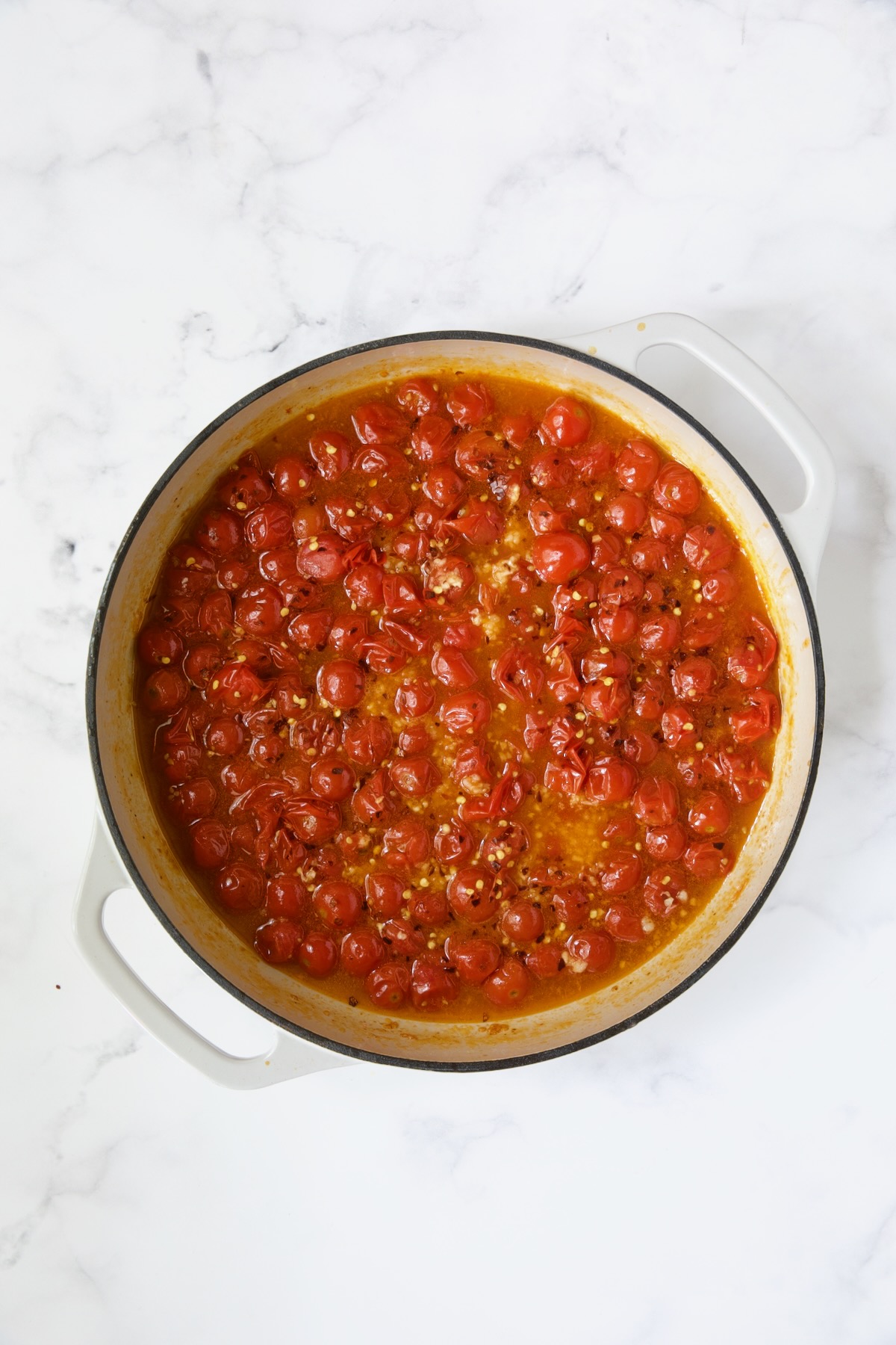 Cherry tomatoes with crushed red pepper flakes added.