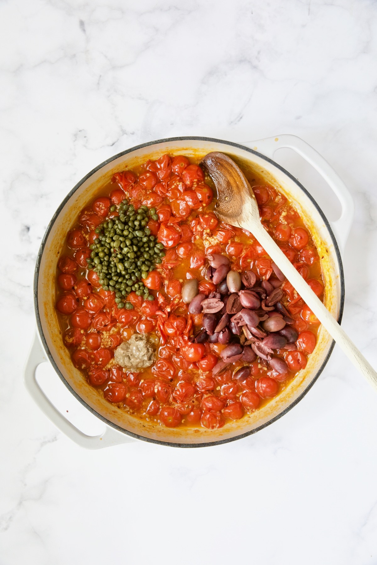 Cherry tomato sauce with capers, anchovy paste and Kalamata olives added.