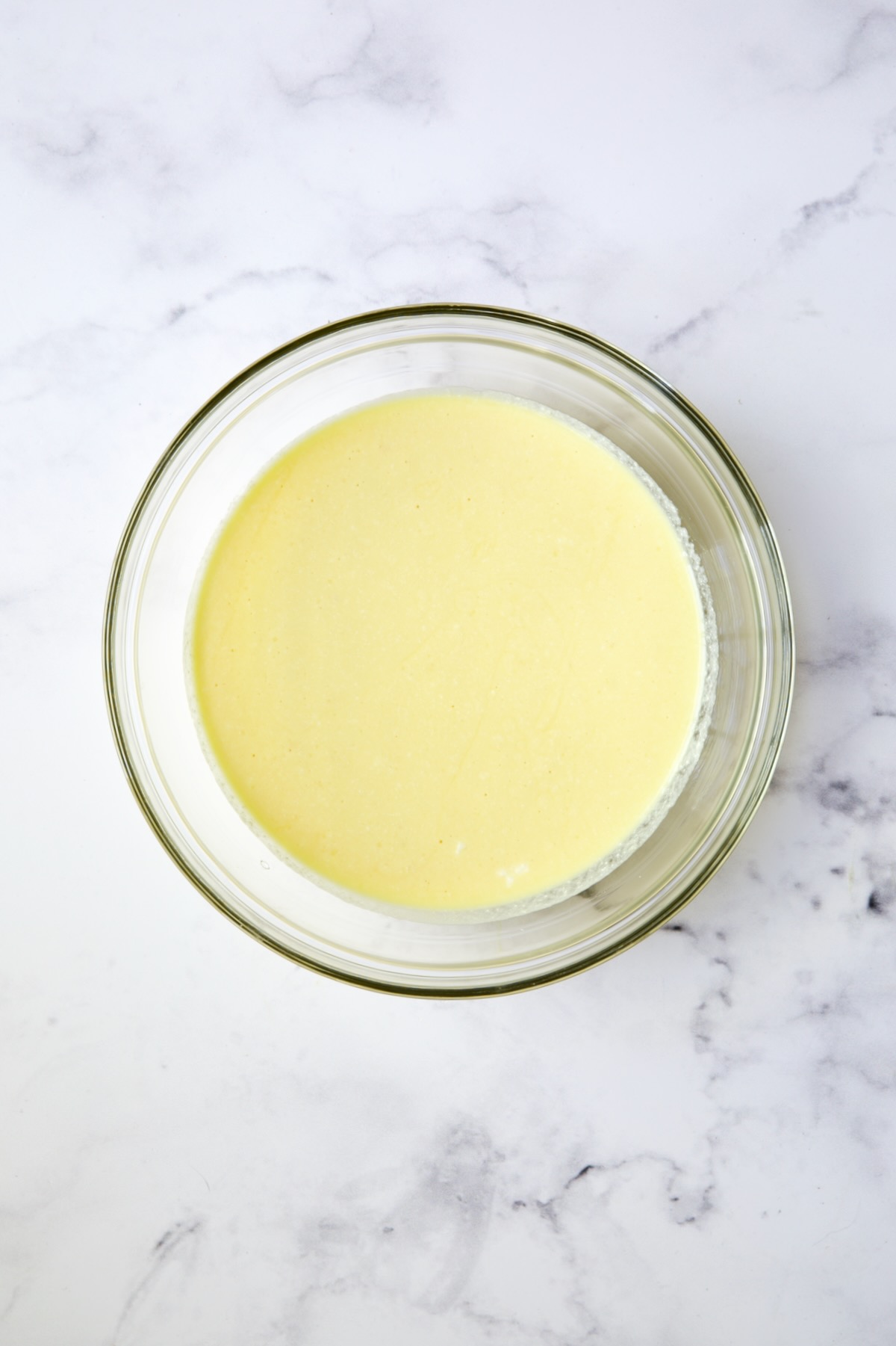 Ricotta and egg combination in glass bowl.
