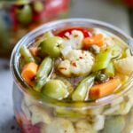 Finished Giardiniera (Italian Pickled Vegetables) in a glass jar.