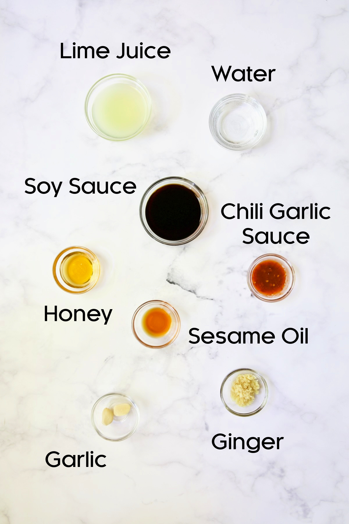 Ingredients for Lime Ginger Dipping Sauce in glass bowls.