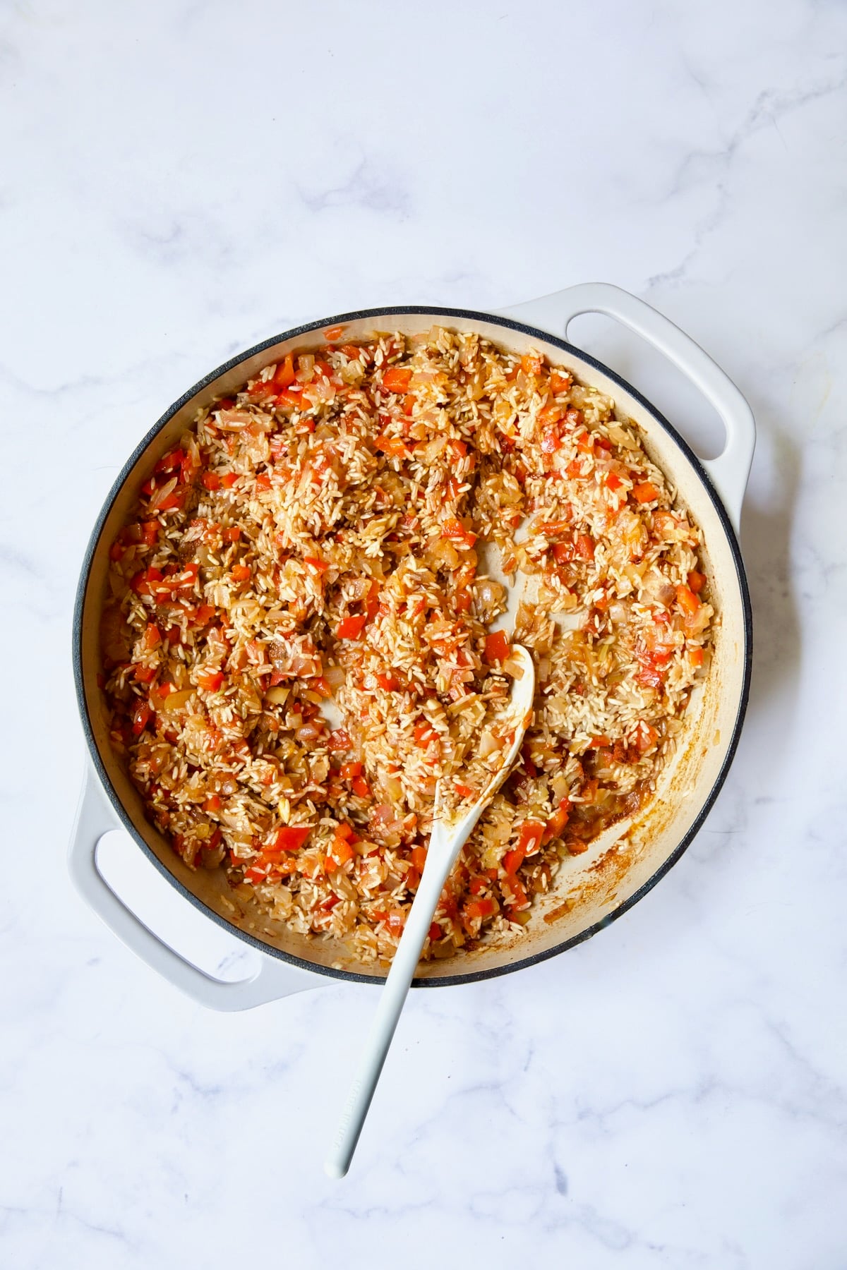 Process shot with rice added to vegetables.