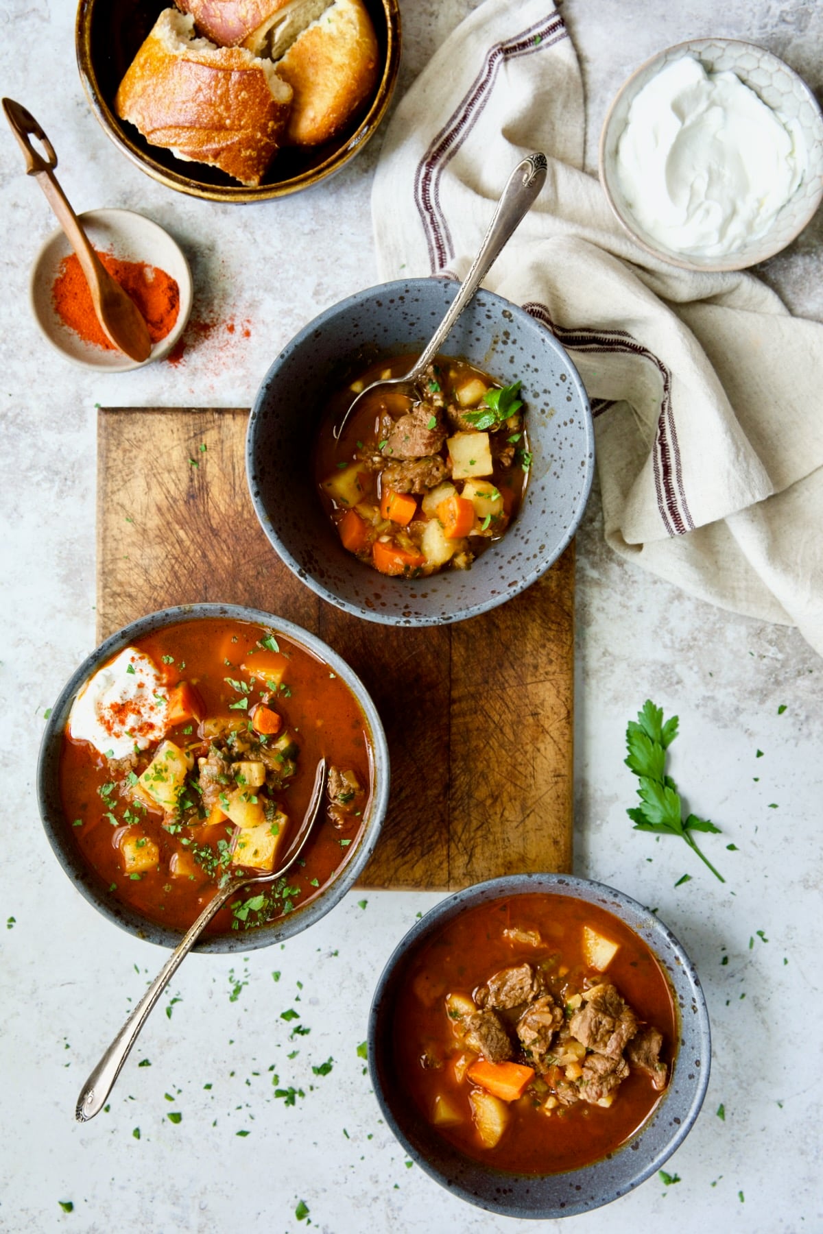 Three bowls of Traditional Hungarian Goulash Soup Recipe.