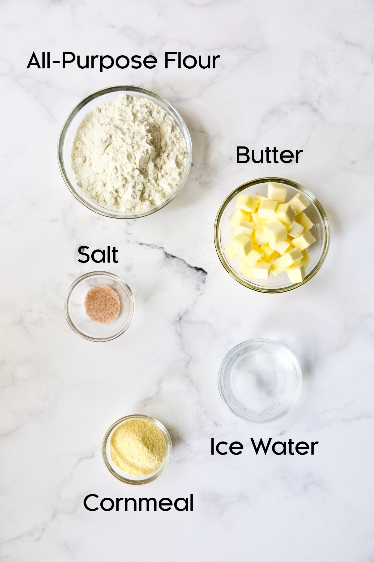 Ingredients for galette dough in glass bowls.