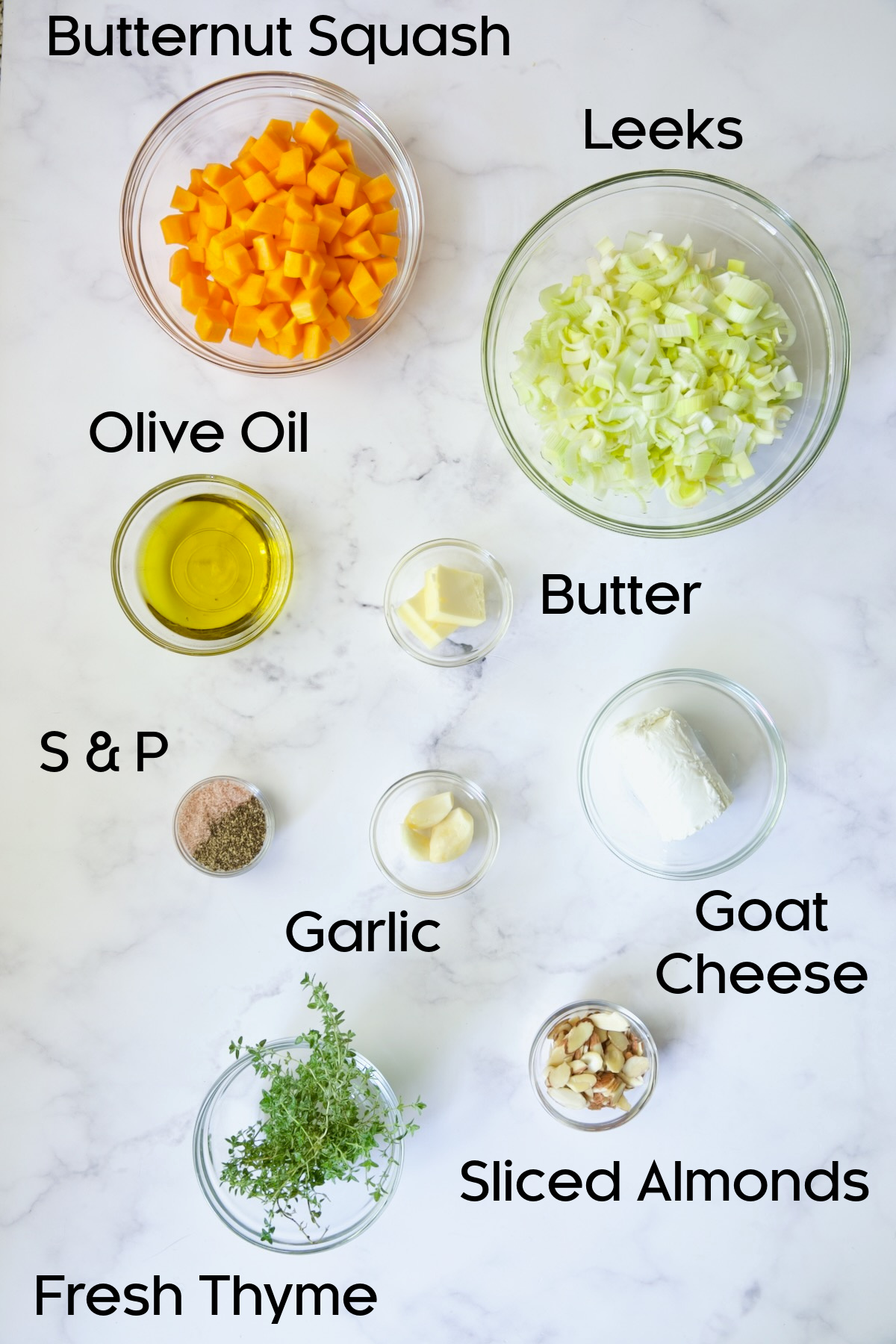 Ingredients for Butternut Squash Leek and Goat Cheese Galette in glass bowls.