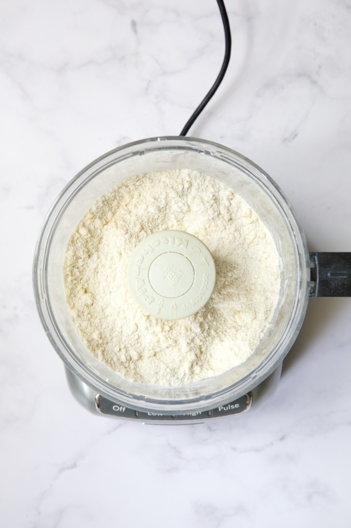 Ingredients for galette dough in food processor after butter is incorporated.