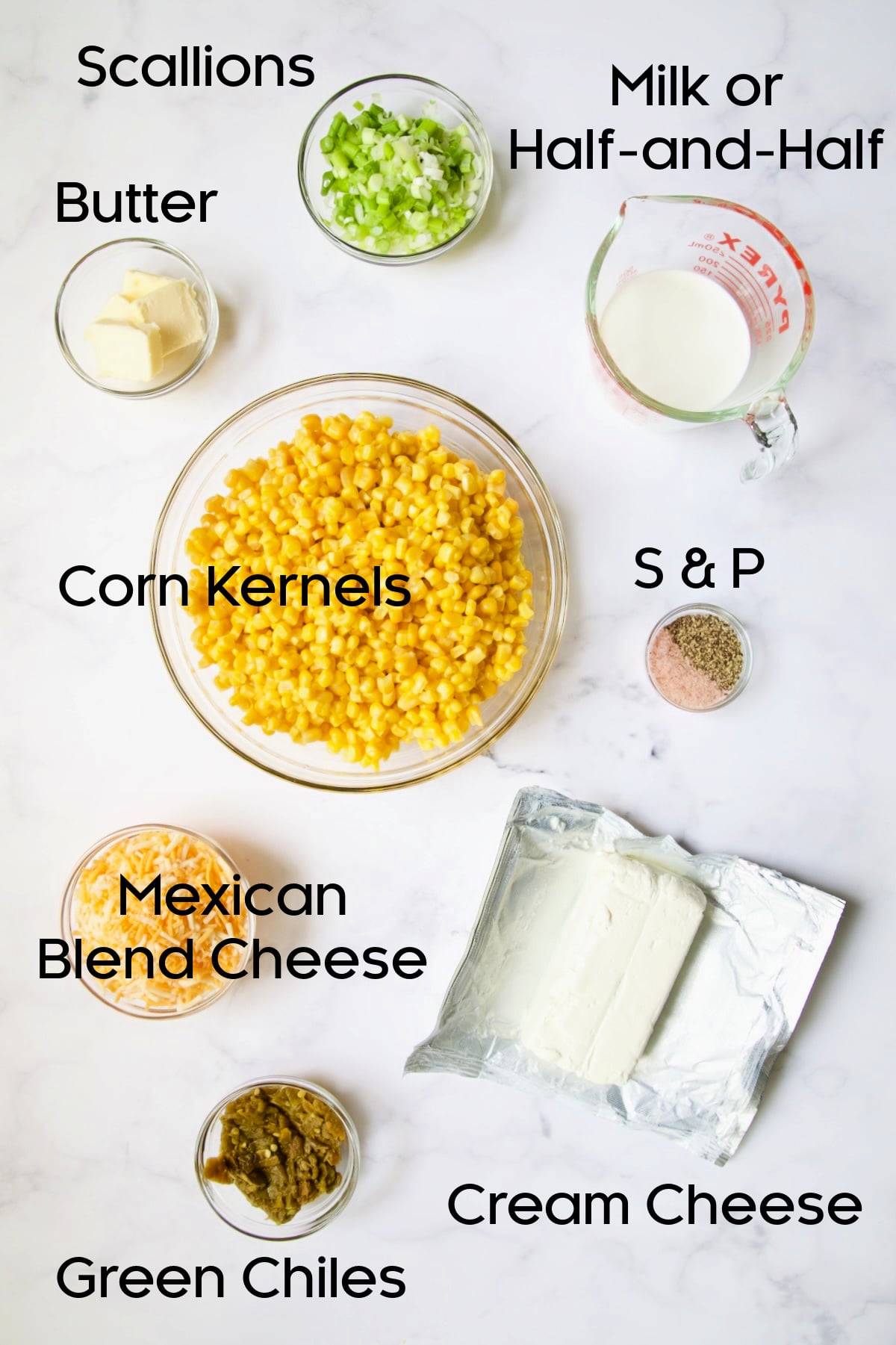 Ingredients for Cream Cheese Corn Casserole with Green Chiles in glass bowls.