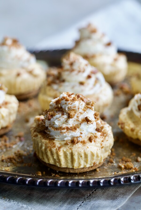Easy Mini No-Bake Pumpkin Cheesecakes on antique silver platter.