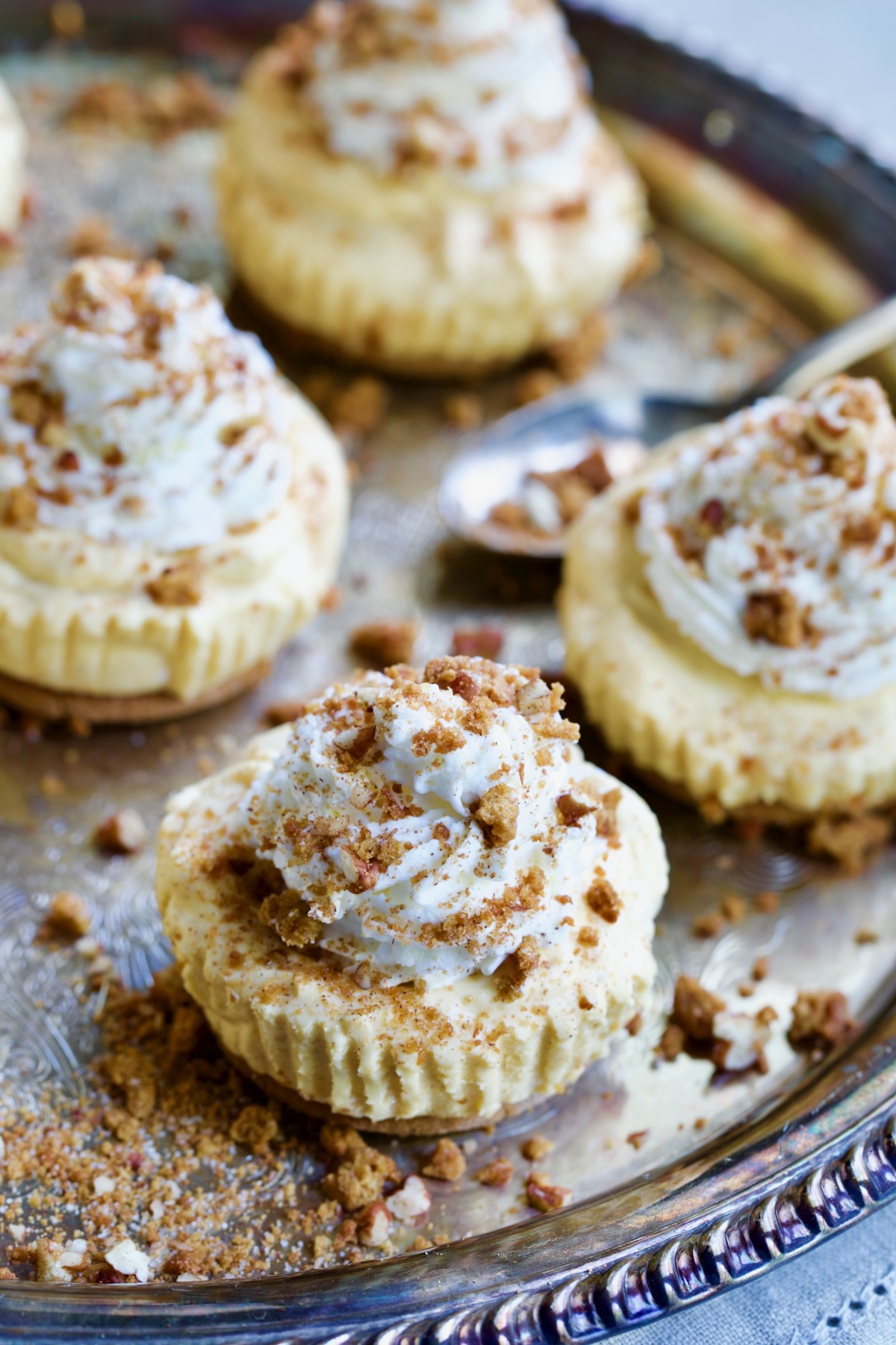 Four Easy Mini No-Bake Pumpkin Cheesecakes with spoon.