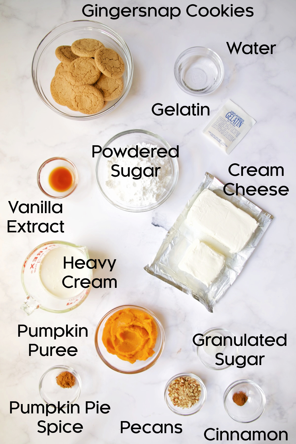 Ingredients for Easy Mini No-Bake Pumpkin Cheesecakes in glass bowls.