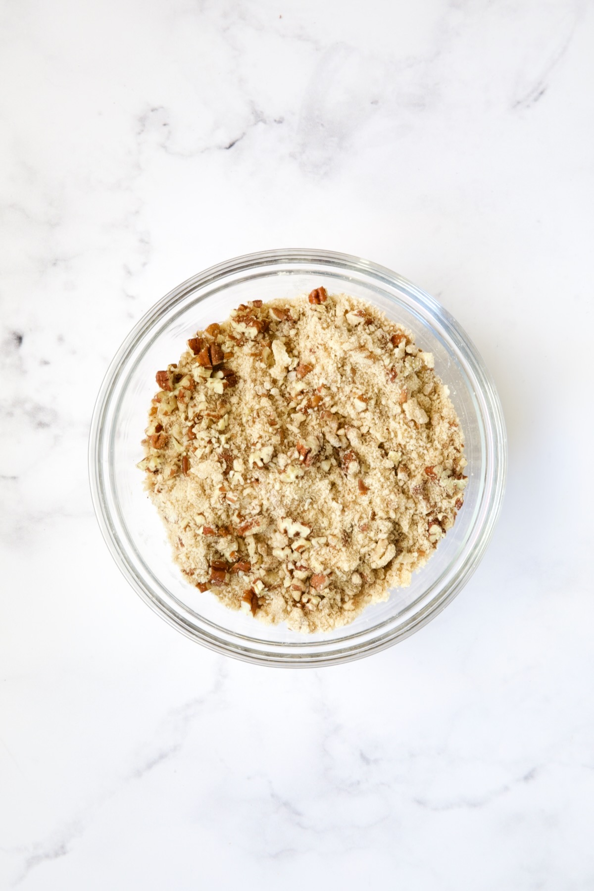 Pecan streusel topping in glass bowl.