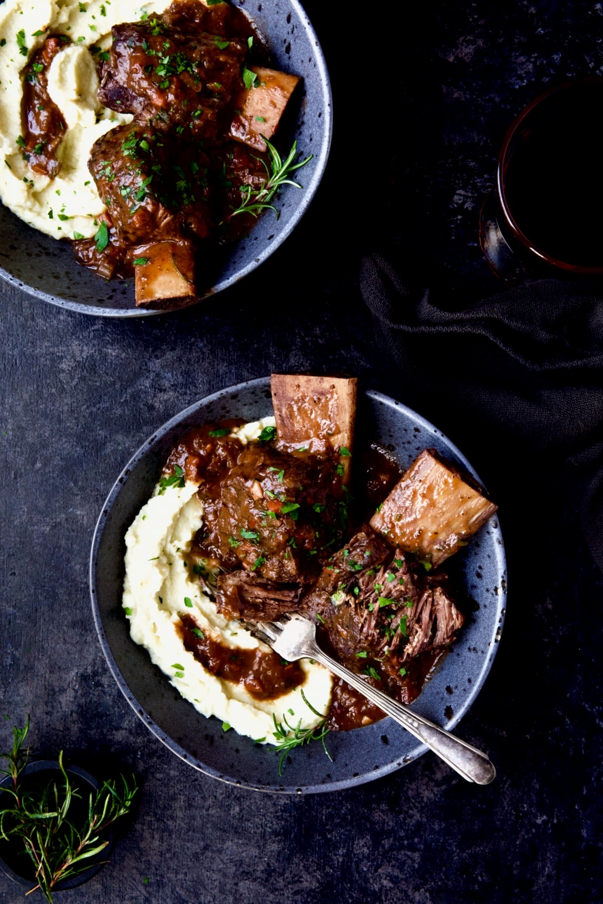 Two bowls of Braised Beef Short Ribs with Cauliflower Leek Puree.