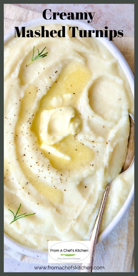 Creamy mashed turnips in oval white bowl topped with butter with serving spoon.