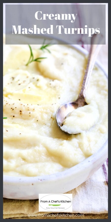 Creamy mashed turnips in oval white bowl topped with butter with serving spoon.
