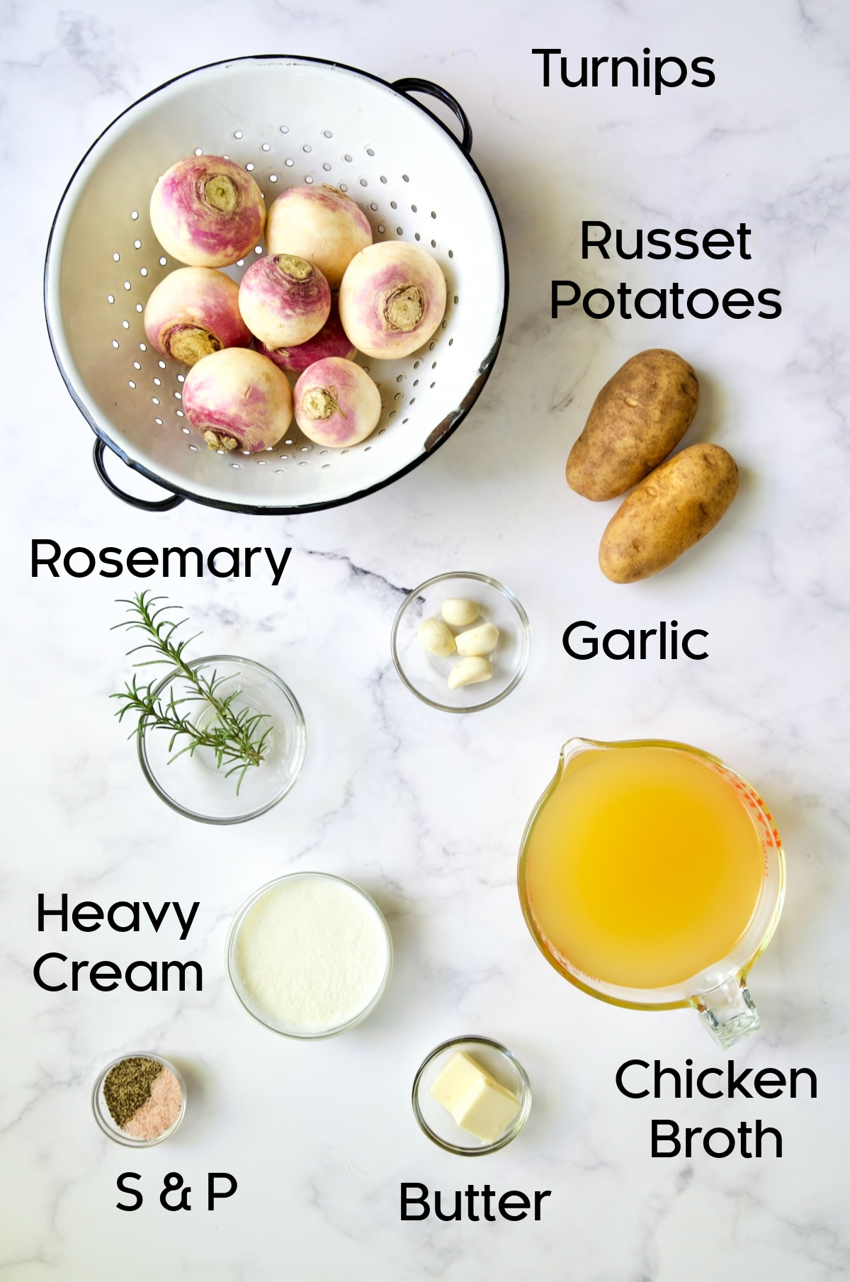 Ingredients for Creamy Turnip Potato Puree in glass bowls and turnips in white colander.