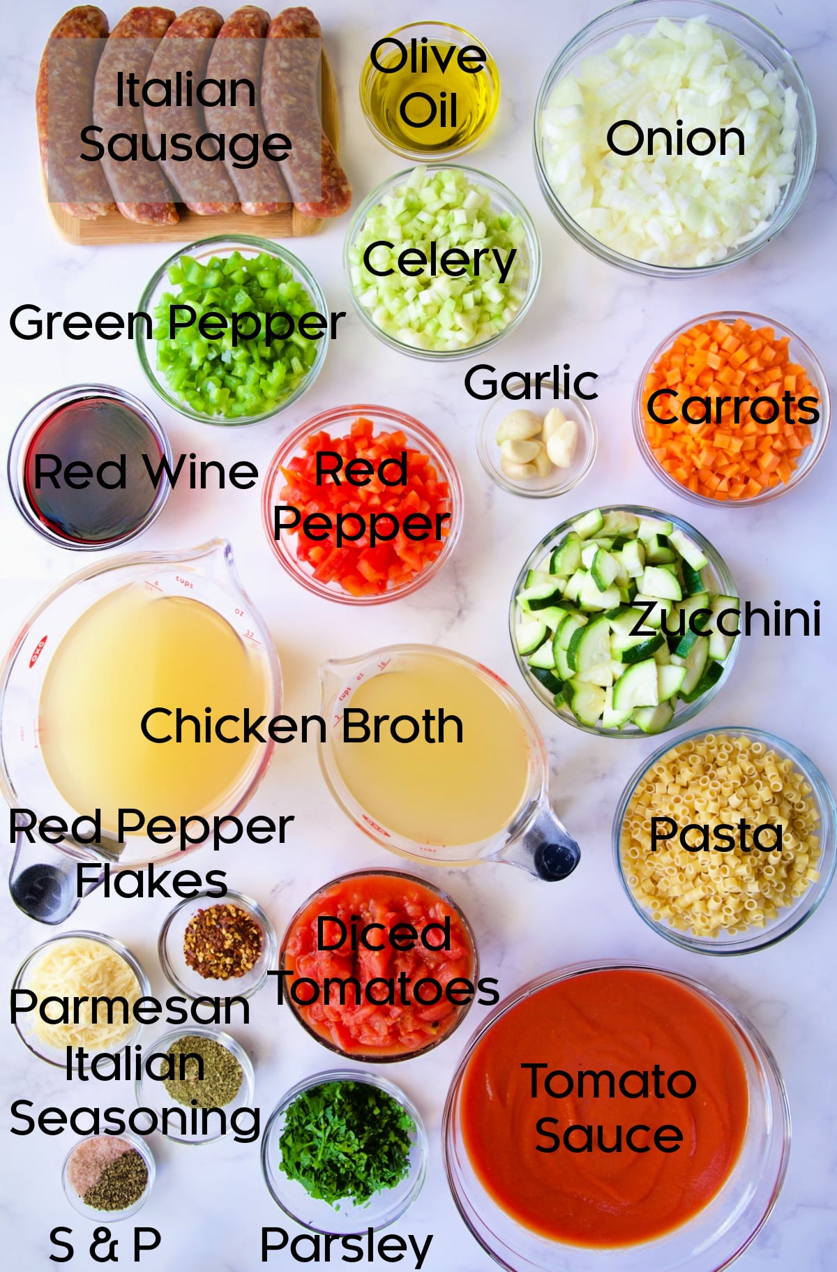 Ingredients for Italian Sausage Soup in glass bowls.