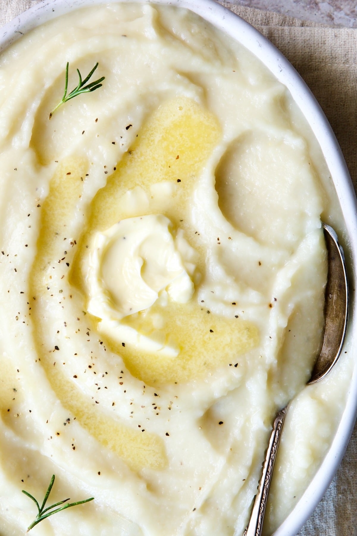 Creamy Mashed Turnip Recipe in white bowl with serving spoon.