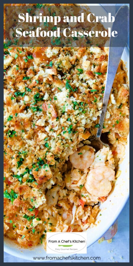 Shrimp and Crab Seafood Casserole in white baking dish with serving spoon scooping some up.