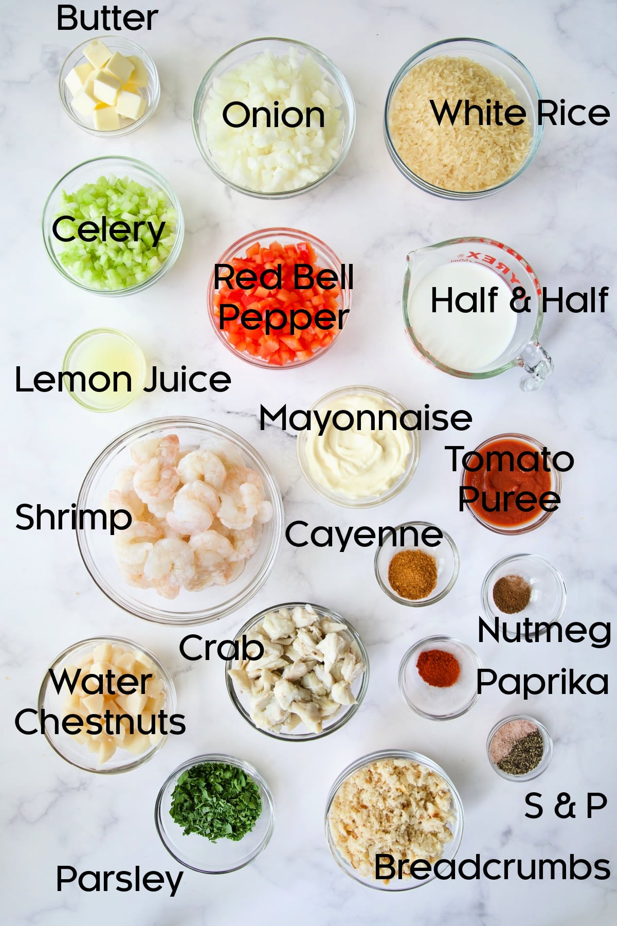 Ingredients for Shrimp and Crab Seafood Casserole in glass bowls.