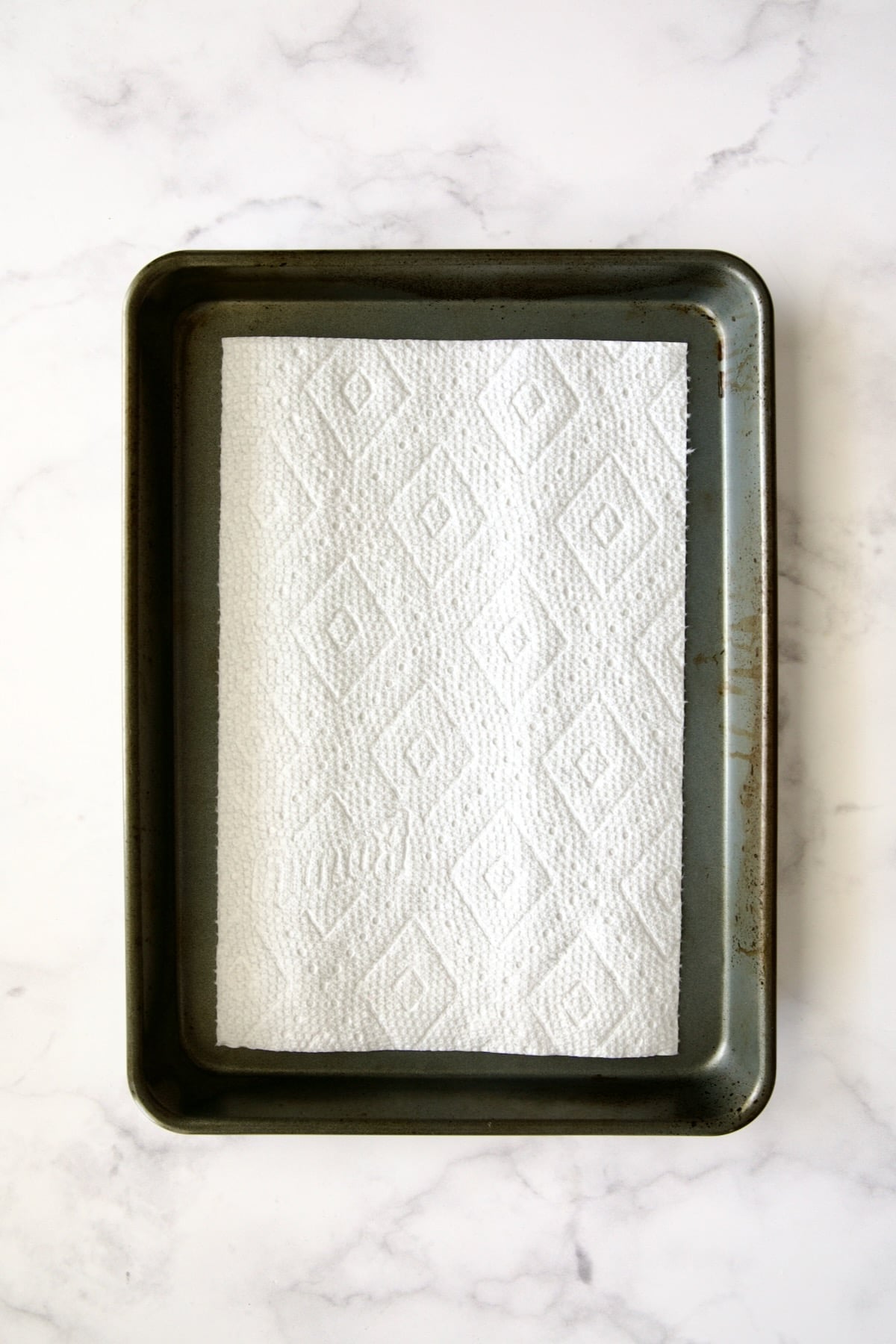 Dry piece of paper towel on rimmed sheet pan.