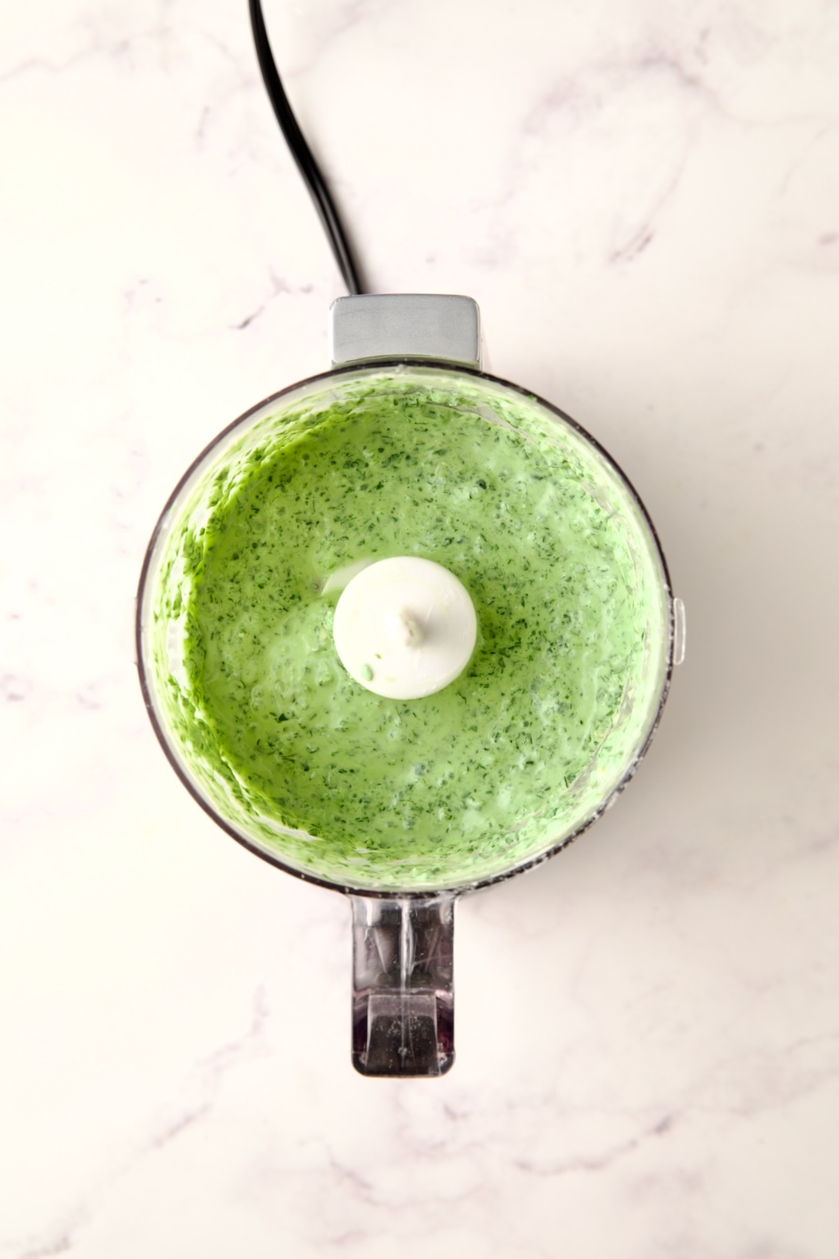 Cilantro chutney in mini food processor.