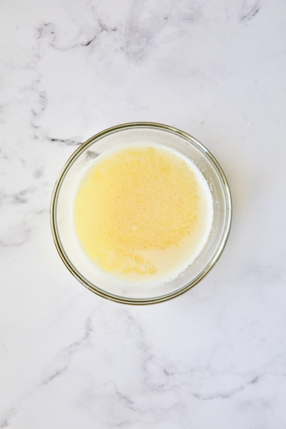 Melted butter in glass bowl.