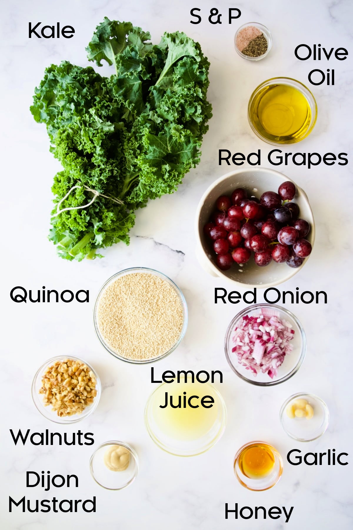 Ingredients for Kale Quinoa Salad with Lemon Honey Dressing in glass bowls.
