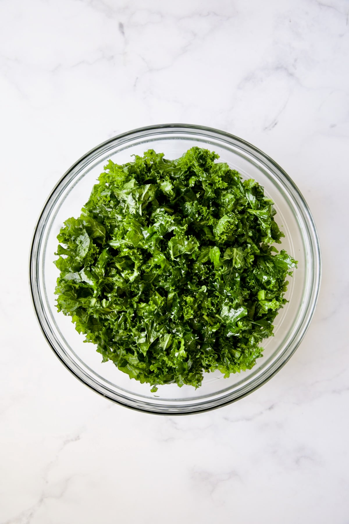 Wilted kale in glass bowl.