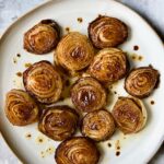 Roasted Onions on round plate.