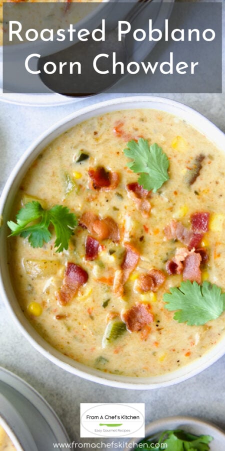 Pinterest graphic for Roasted Poblano Corn Chowder showing it in white bowl garnished with cilantro sprigs.