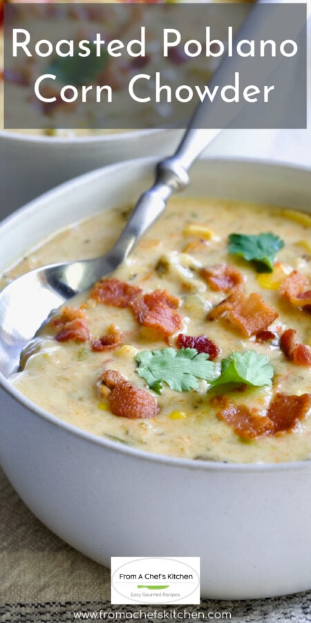 Pinterest graphic for Roasted Poblano Corn Chowder showing it in a white bowl with spoon garnished with cilantro leaves.