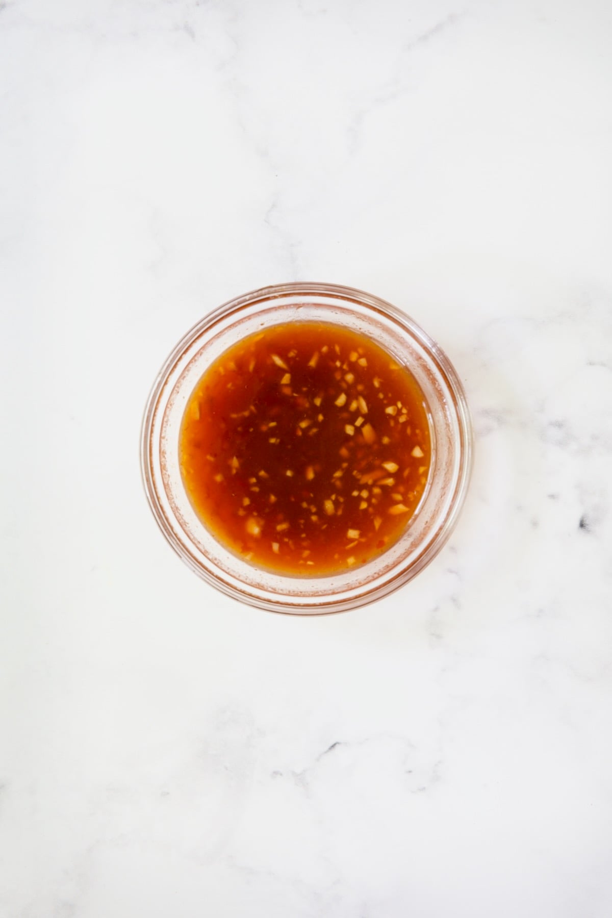 Glass bowl with sweet chili glaze.