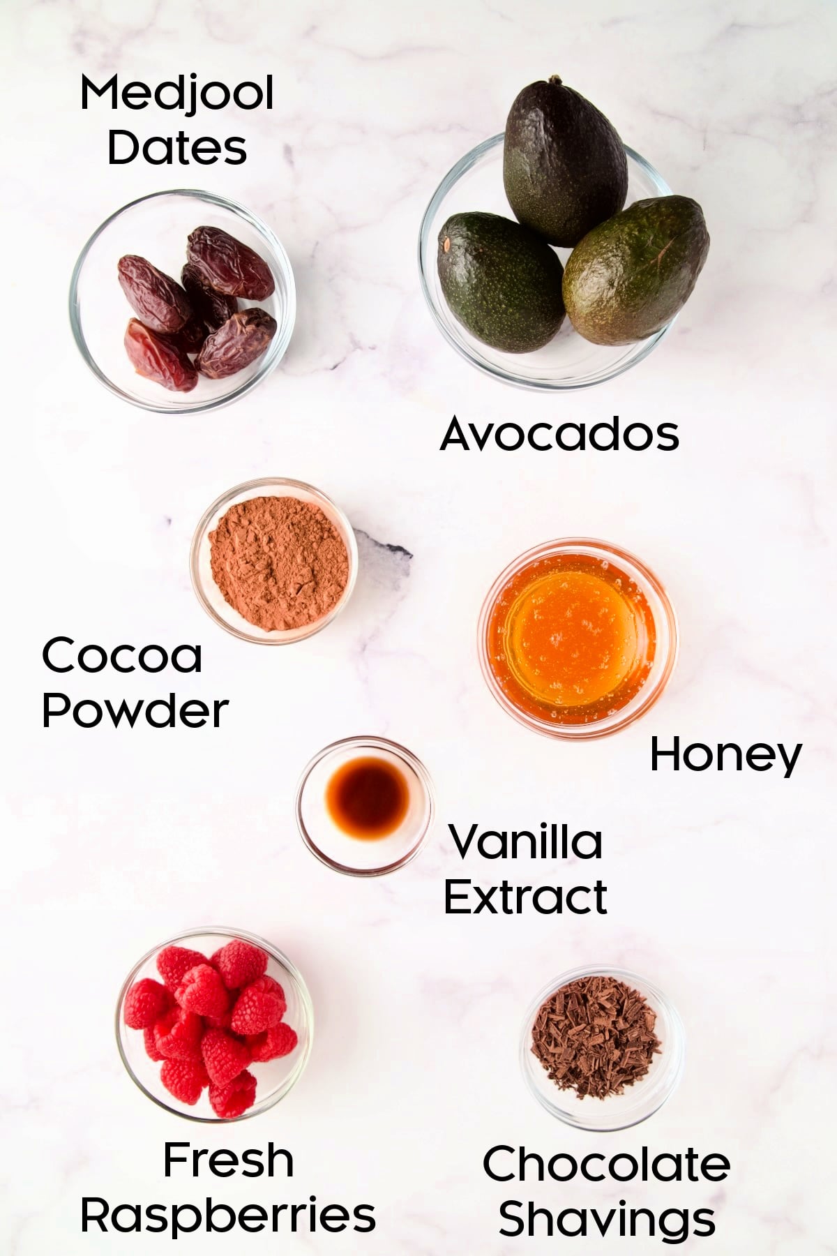 Ingredients for Chocolate Avocado Mousse in glass bowls.