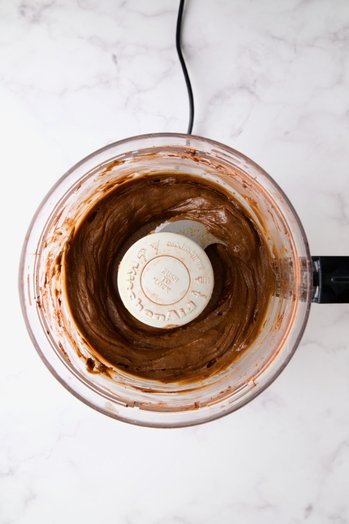 Pureed Chocolate Avocado Mousse in food processor.