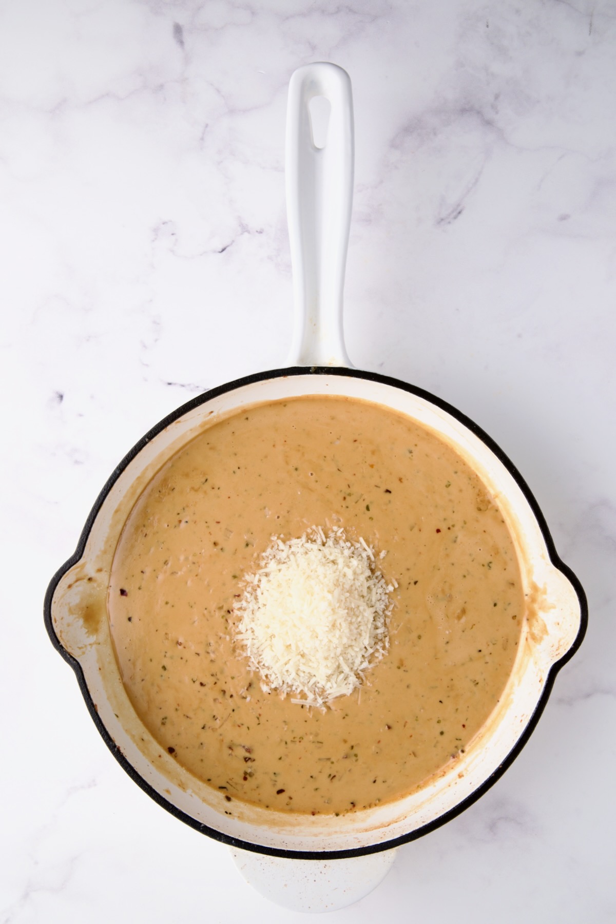 Cooked sauce with Parmesan cheese added.