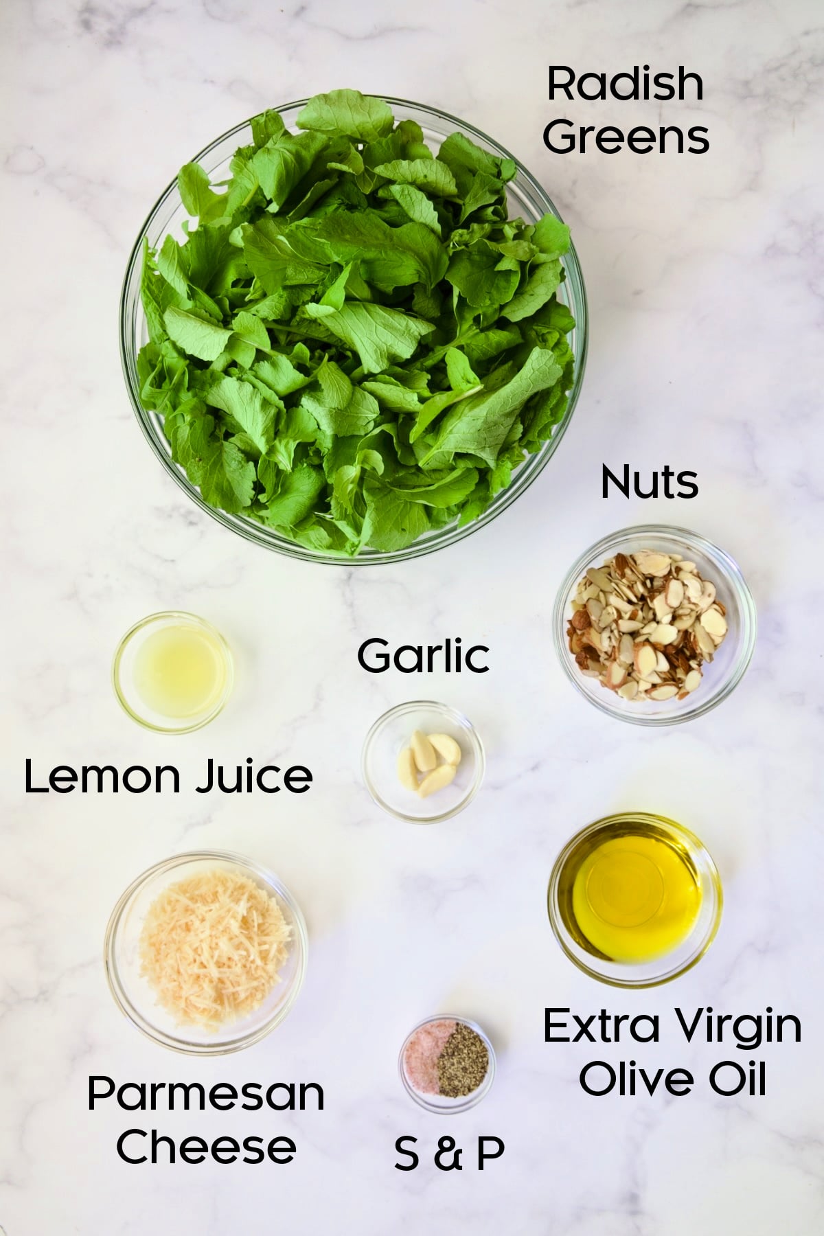 Ingredients for Radish Greens Pesto in glass jars.