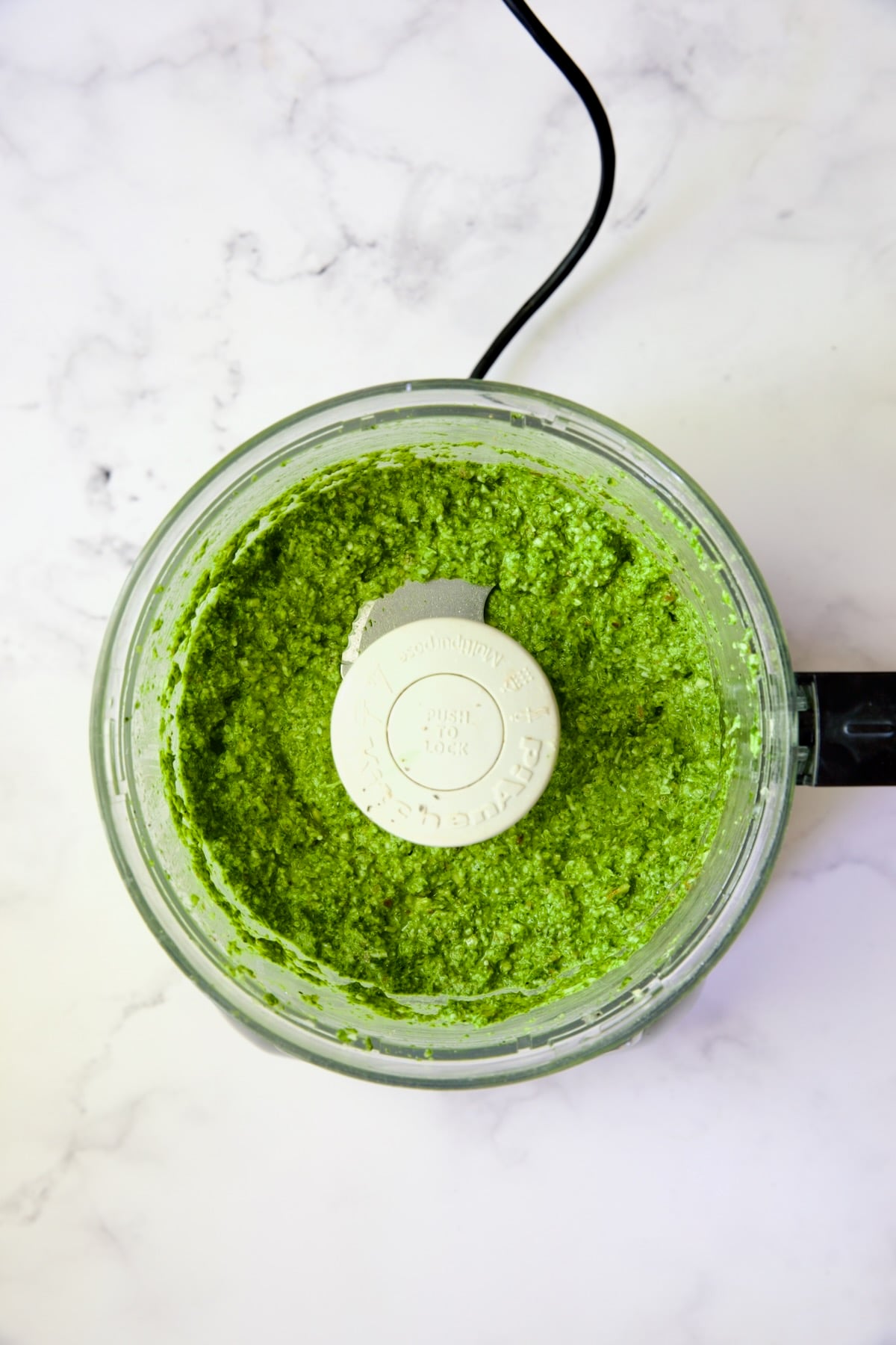 Finished pesto in food processor.