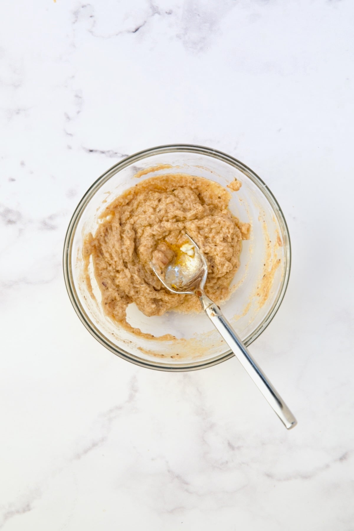 Flour, butter and some of braising liquid in glass bowl.
