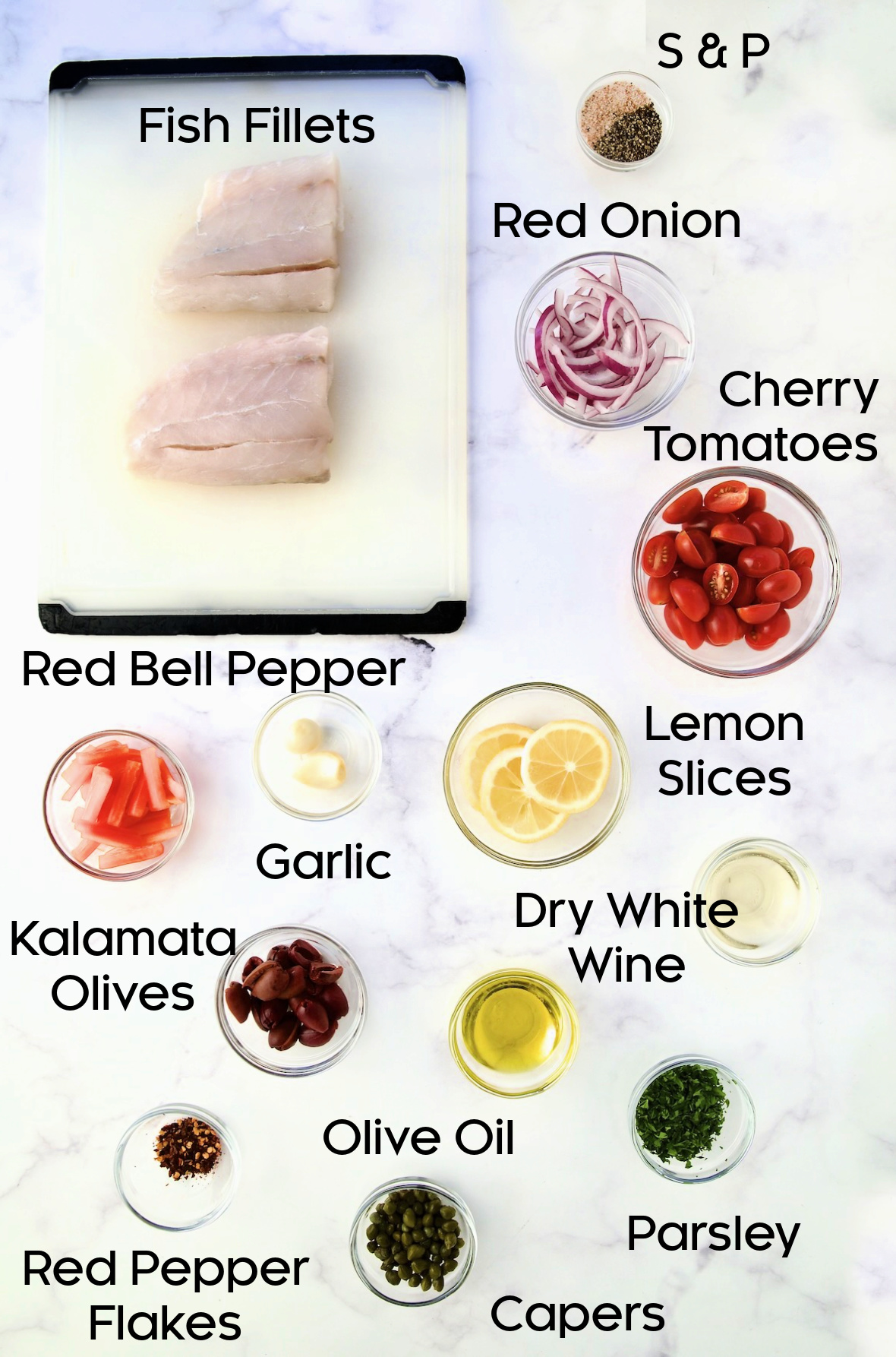 Ingredients for Mediterranean Fish en Papillote in glass bowls.