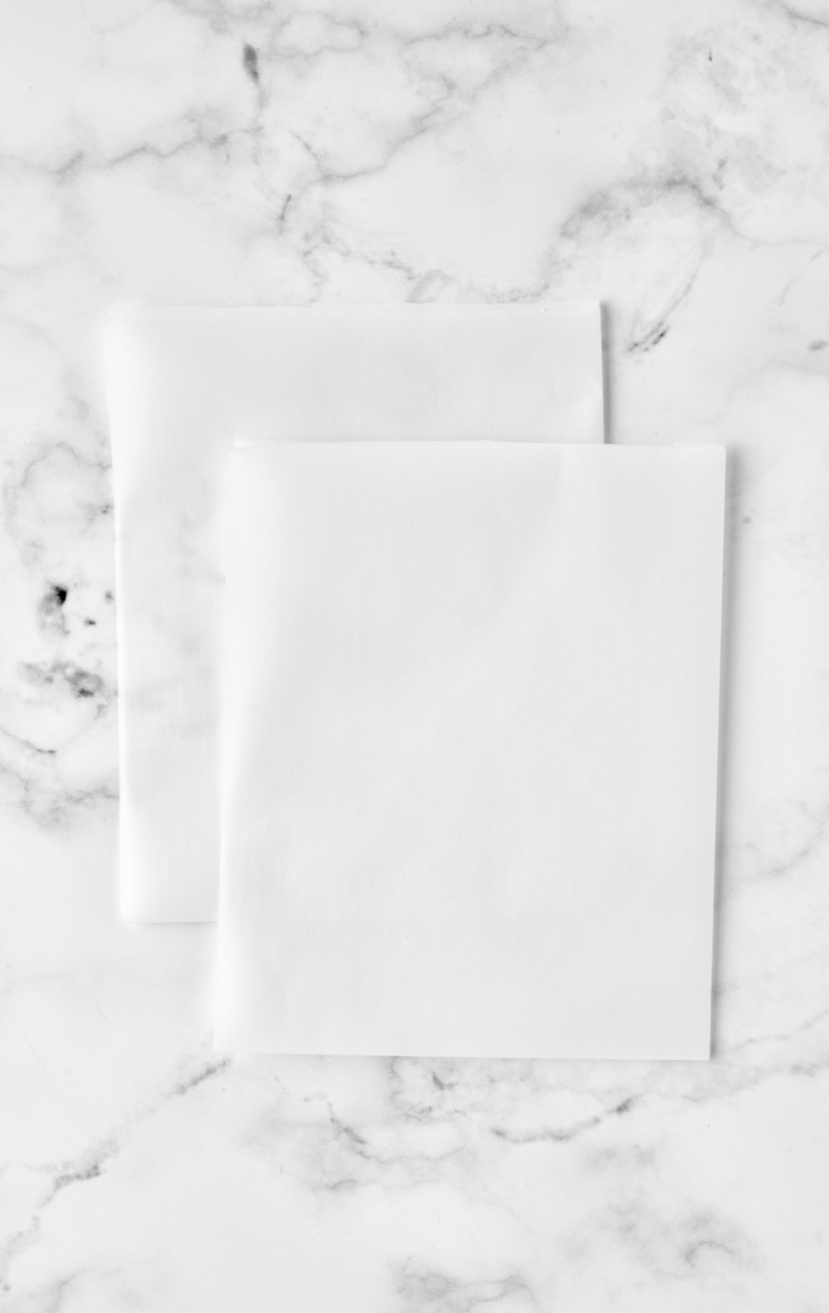 Two pieces of parchment paper.