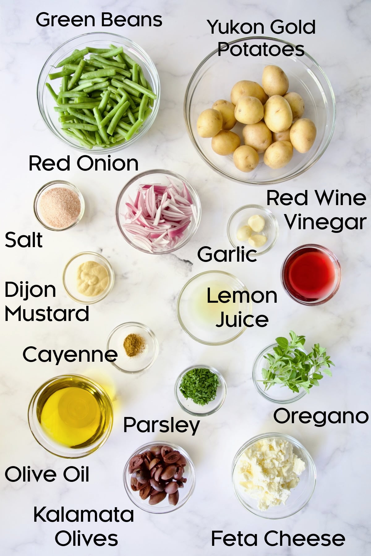 Ingredients for Potato Green Bean Salad in glass bowls.