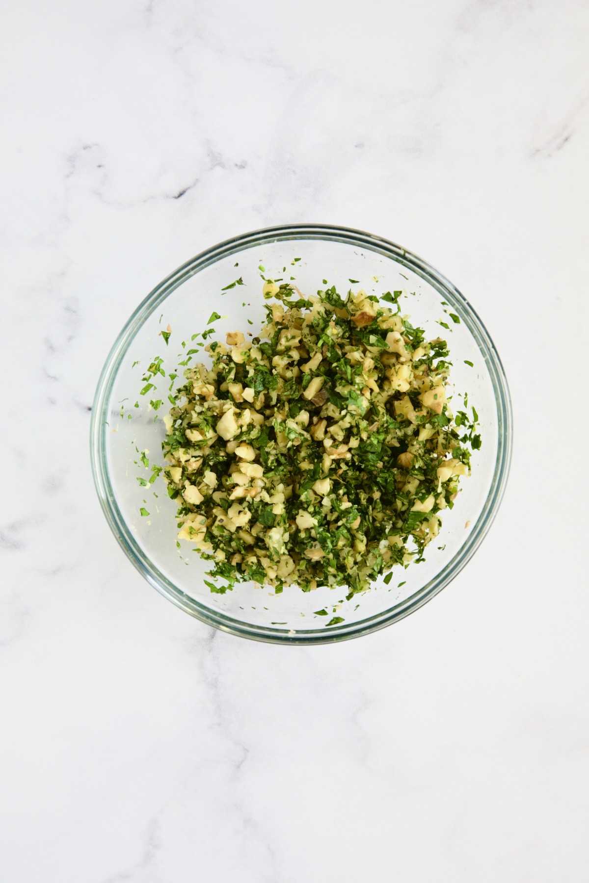 Walnut Lemon Gremolata in glass bowl.
