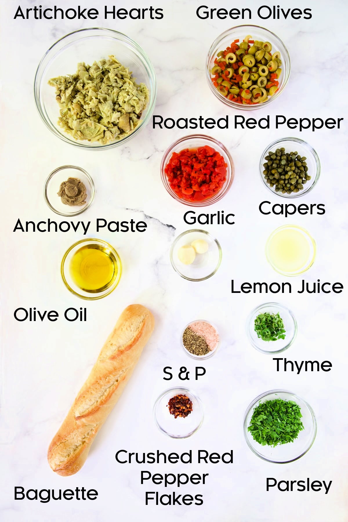 Ingredients for Artichoke Tapenade in glass bowls.