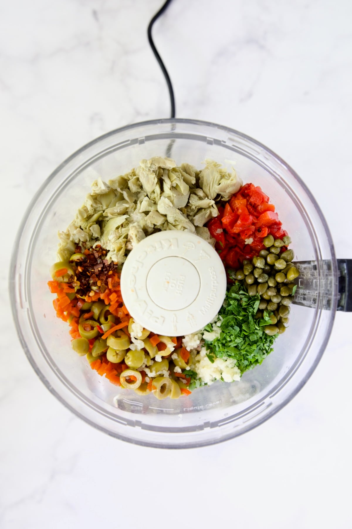 Ingredients for Artichoke Tapenade in food processor before being pureed.