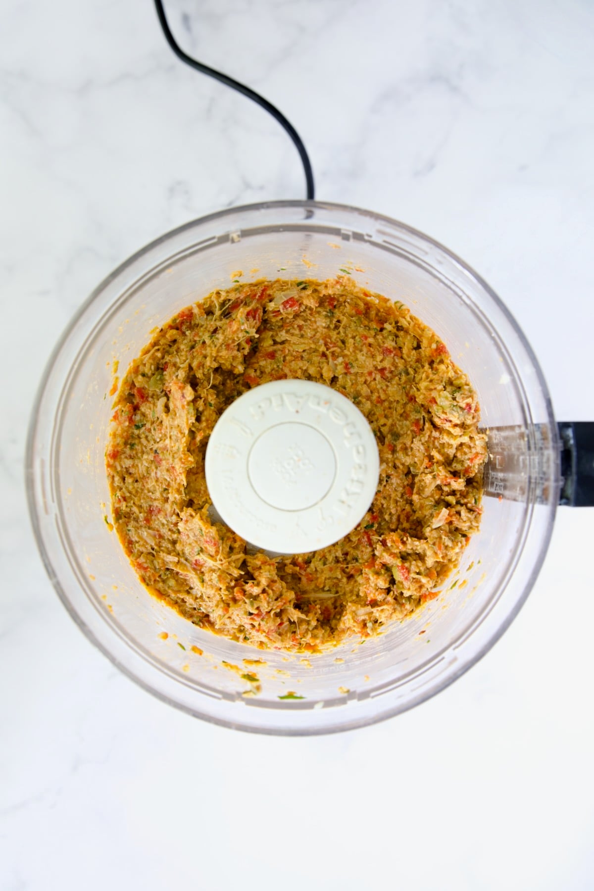 Artichoke Tapenade in food processor after being pureed.