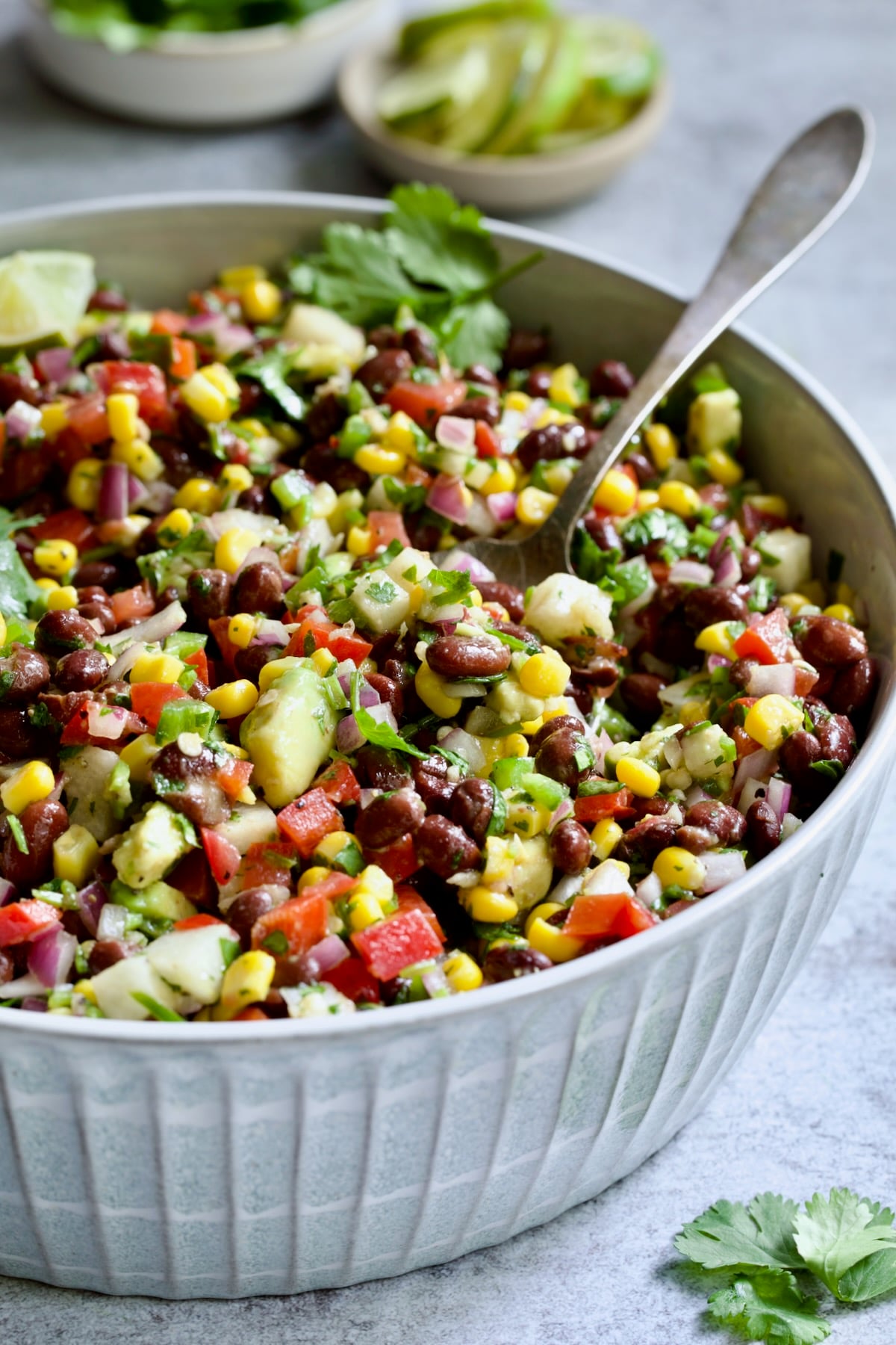 Southwestern Salad in bowl with serving spoon.